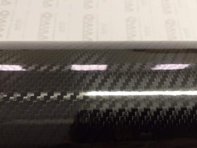 VViViD close-up of black carbon weave texture showing hyper-realistic depth