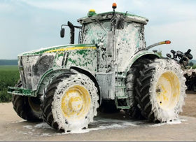 W large truck being rinsed after application for efficient fleet cleaning benefit