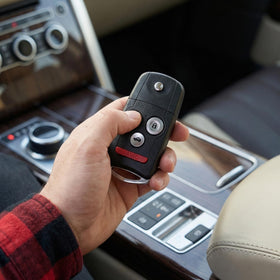 WADMHYACE key fob in hand showing size and ergonomic grip benefit