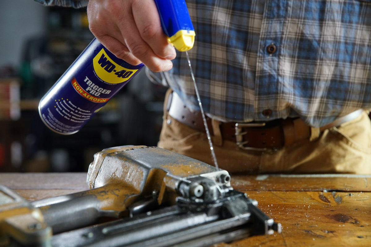 WD-40 Trigger Pro spray detail on hinge demonstrating precise application and rust prevention
