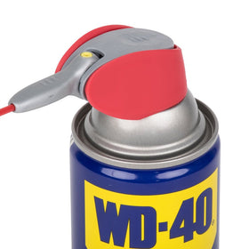 WD-40 broad spray applied to a door hinge protecting metal from moisture