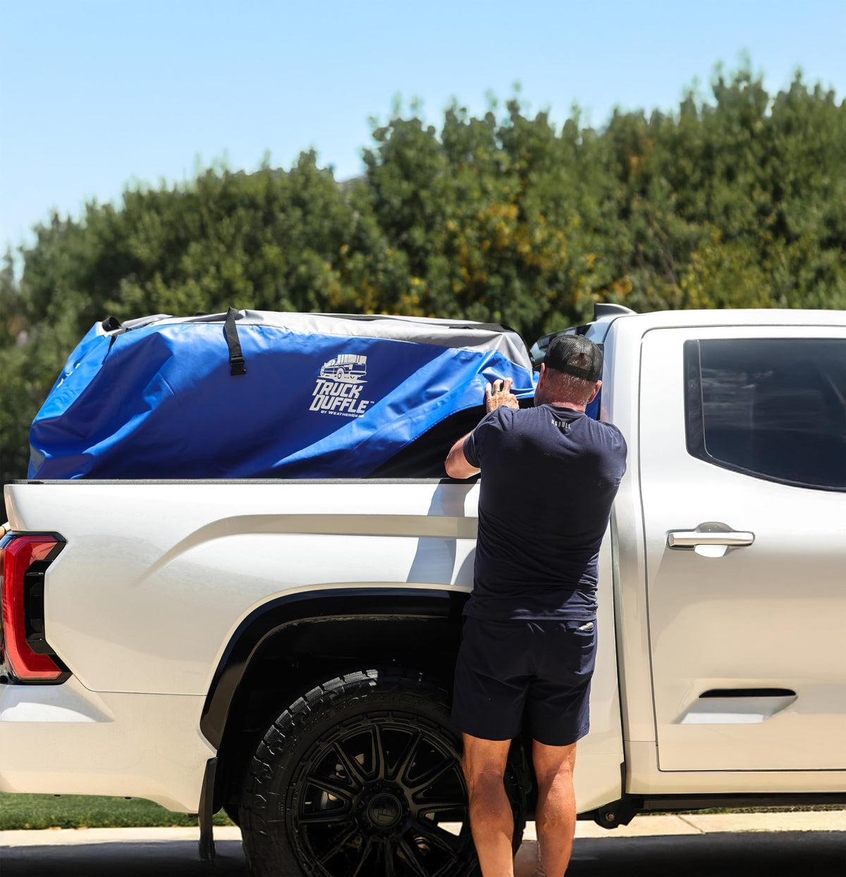 WeatherGear TruckDuffle loaded with camping gear showing organized transport convenience