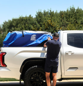 WeatherGear TruckDuffle loaded with camping gear showing organized transport convenience