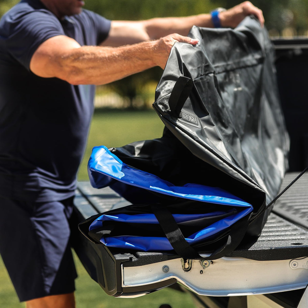 WeatherGear TruckDuffle next to suitcases illustrating capacity and real-world scale
