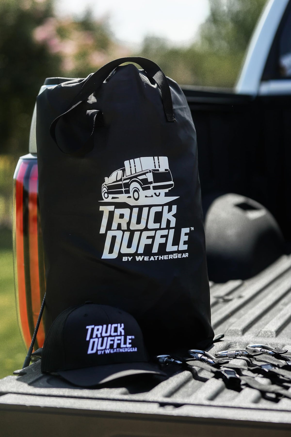 WeatherGear TruckDuffle being removed from truck bed to show easy detachment and portability
