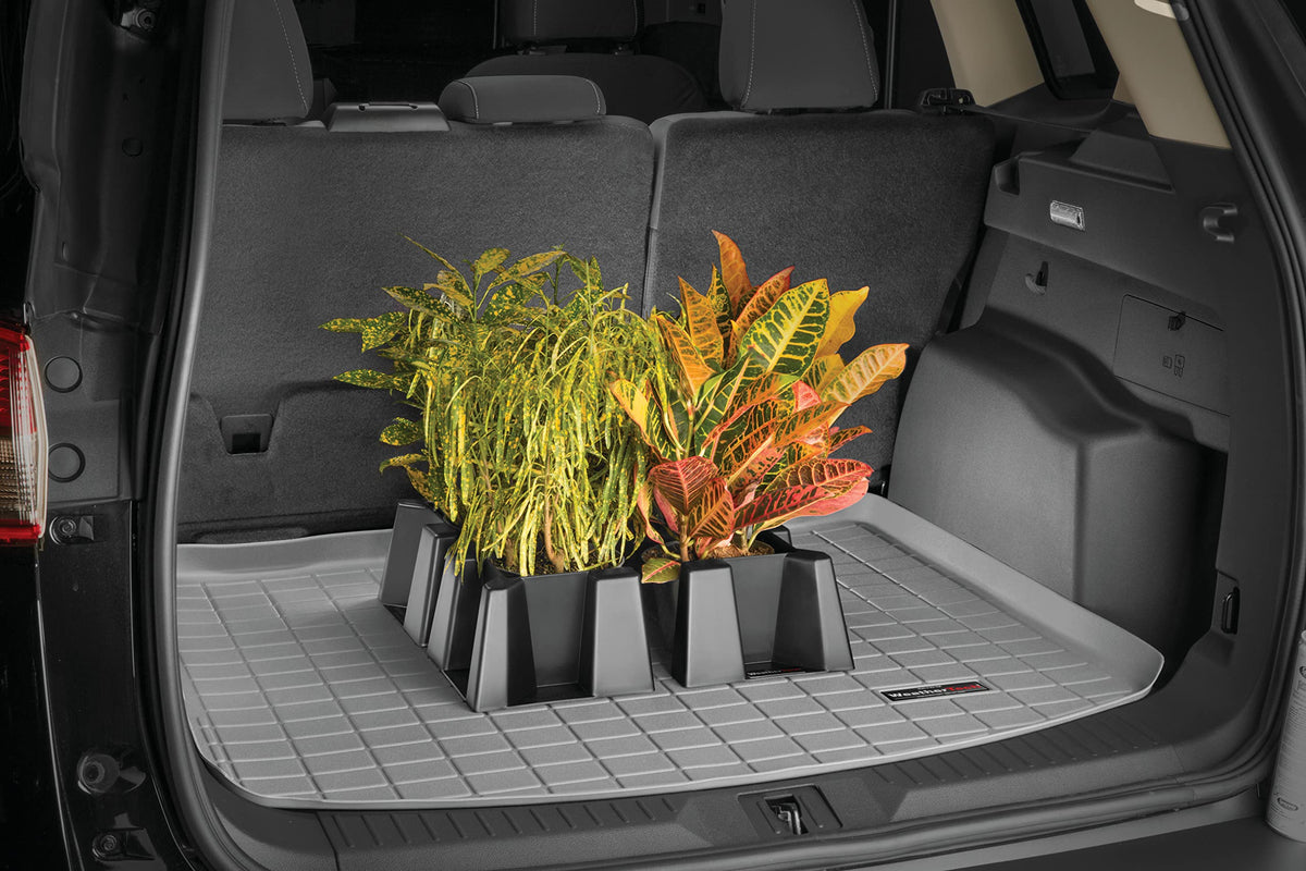 WeatherTech CargoTech in garage lifestyle scene showing organized trunk benefit
