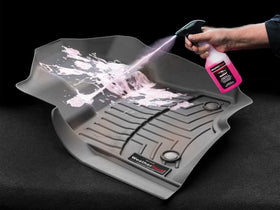 WeatherTech cleaner in use on FloorLiner lifting sand and grime for easier removal