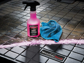 WeatherTech garage lifestyle shot cleaning mats to maintain protection and vehicle appearance