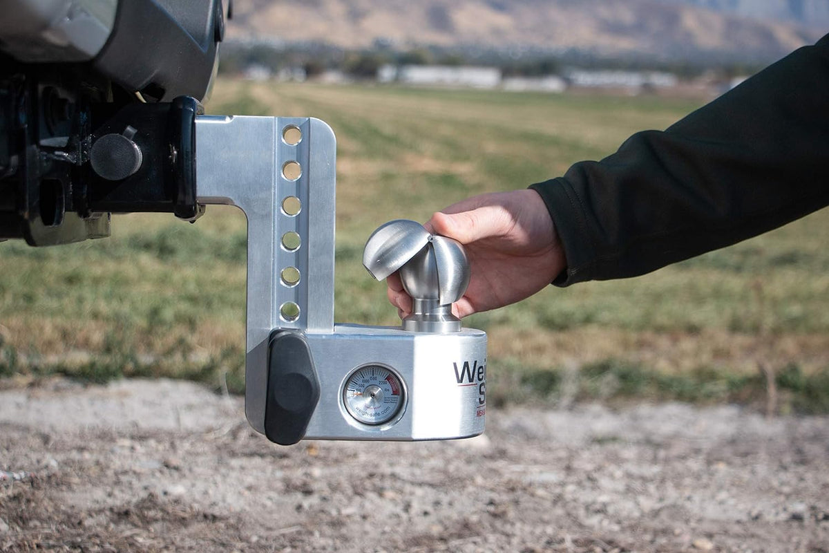 Weigh Safe clamshell in a trailer hookup scene showing reliable on-road performance