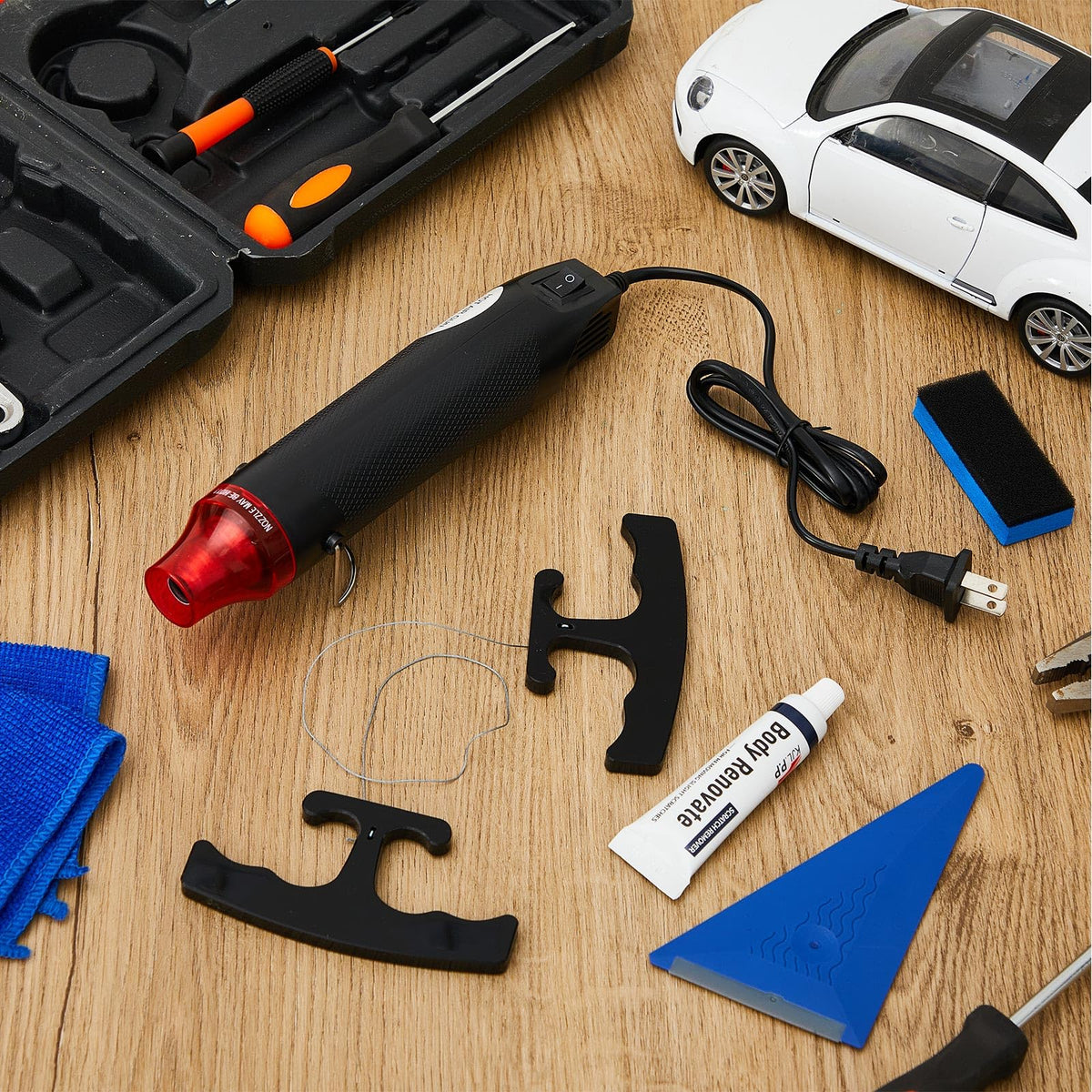 WILLBOND tools beside a hand to show scale and portability benefits