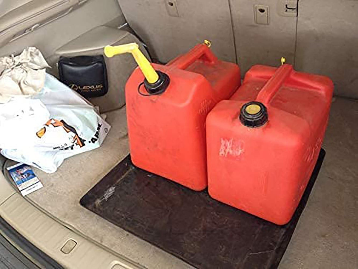 WirthCo Funnel King in car trunk holding containers to prevent stains