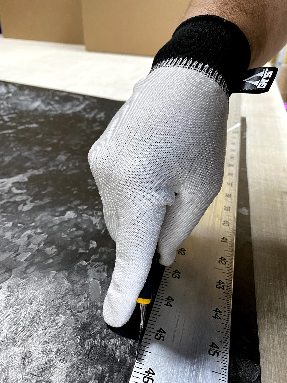 Generic WrapGlove on hand demonstrating one-size fit for medium to XL benefit