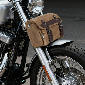 WUMOTIX on motorcycle in outdoor scene illustrating stylish utility