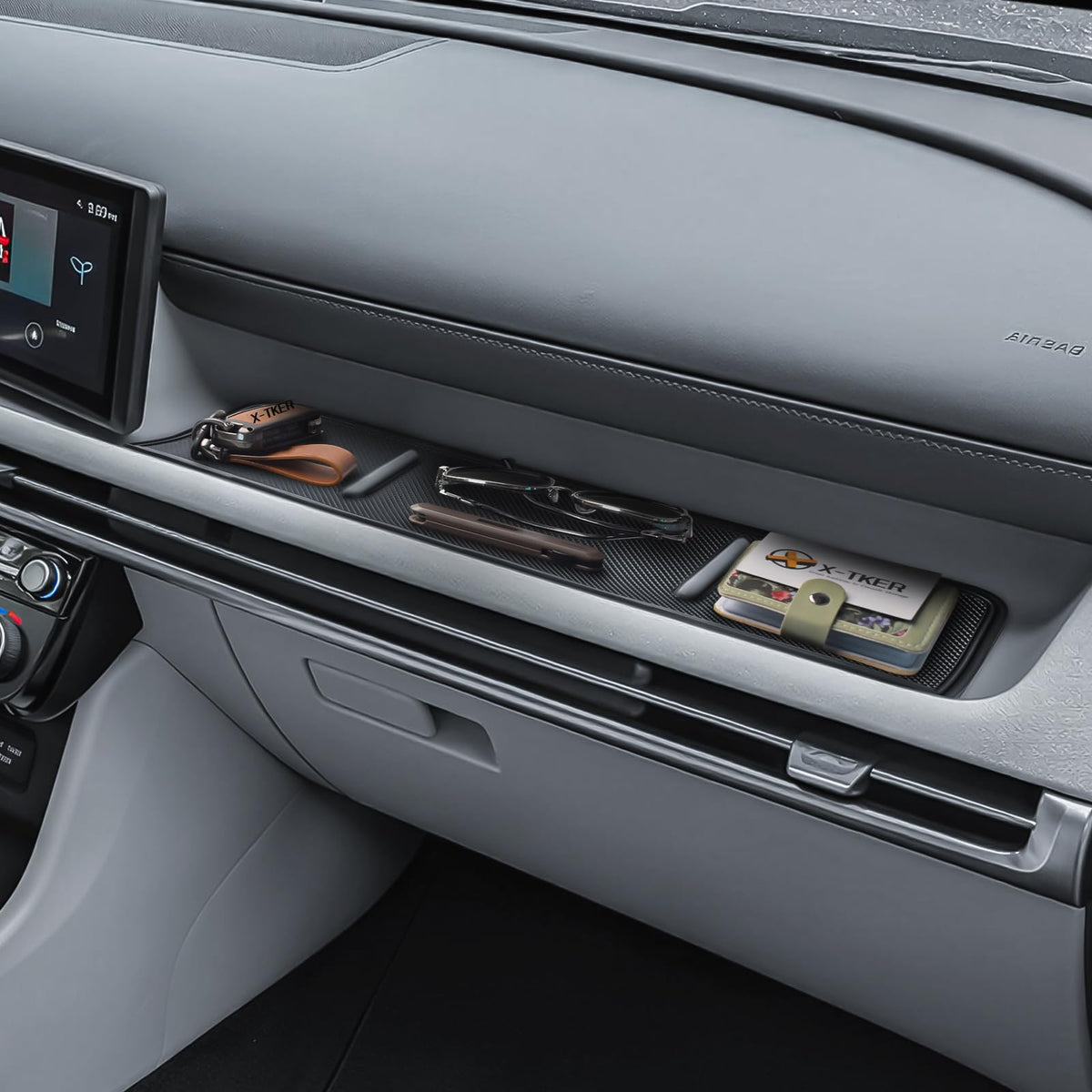 X-TKER lifestyle image of passenger tray with organized items