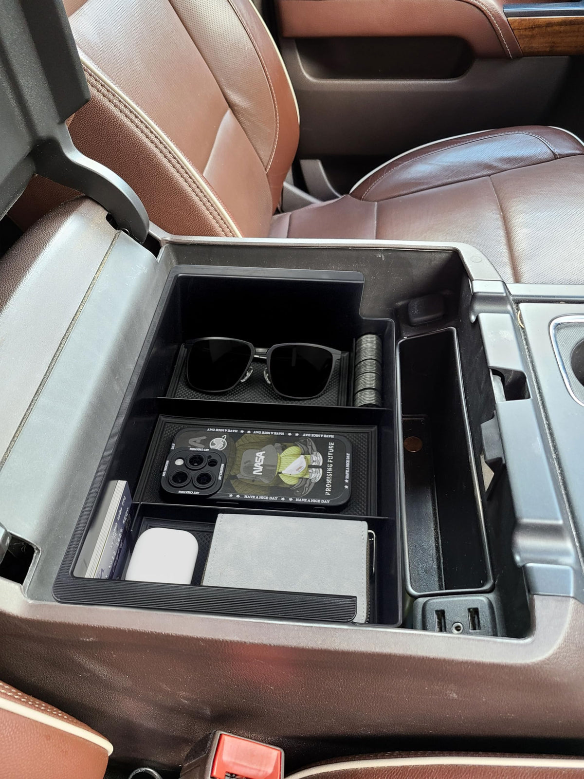 Xaido organizer holding phone sunglasses and cables keeps items visible and tidy