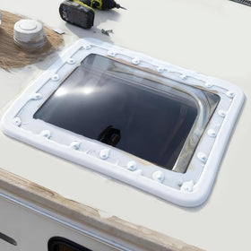 XMK skylight next to ladder showing scale and lightweight handling benefit