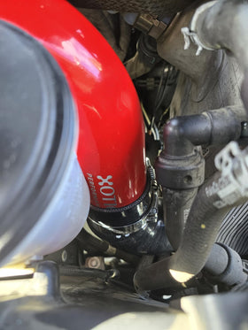 Xotic Performance stainless spring-loaded T-bolt clamp close-up ensuring tight seal
