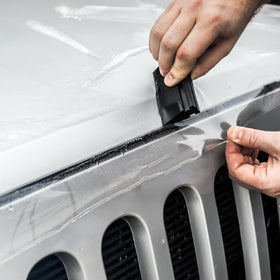 XPEL installed on parked car showing discreet protection benefit