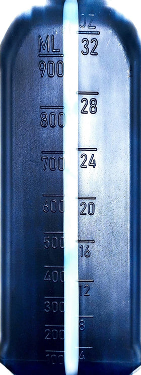 YAMAHA Yamalube two-quart bottle beside measuring cup for size clarity