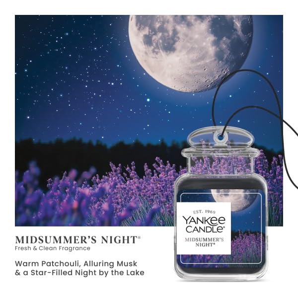 Yankee Candle Car Jar hanging from rearview mirror freshening cabin air