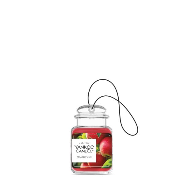 Yankee Candle Macintosh hanging in car offering fresh apple scent and odor neutralizing benefit
