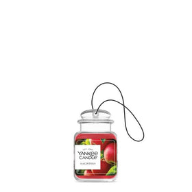 Yankee Candle Macintosh hanging in car offering fresh apple scent and odor neutralizing benefit
