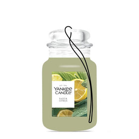 Hanging Yankee Candle Car Jar on a rearview mirror providing continuous odor neutralizing benefit