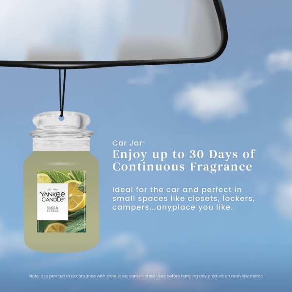 Yankee Candle Car Jar on dashboard in everyday car scene showing fresh-smelling cabin benefit