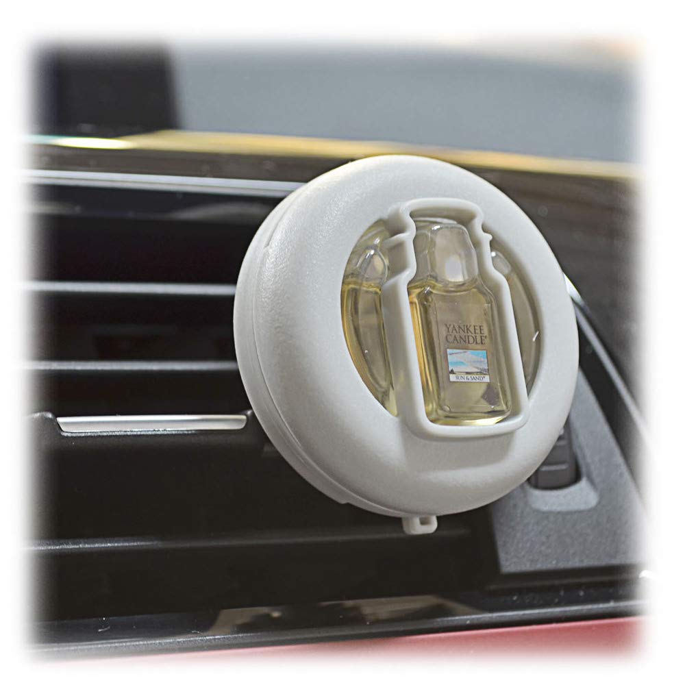 Yankee Candle vent clip clipped to car vent demonstrating installation and steady fragrance distribution