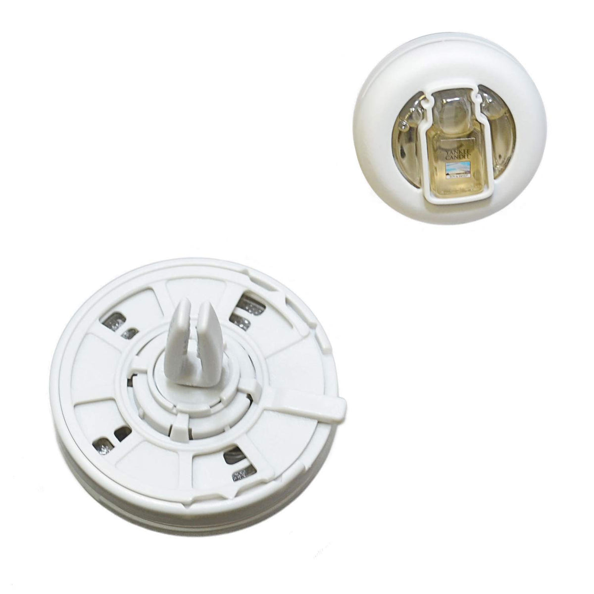 Yankee Candle vent clip close-up of clear reservoir showing liquid level and adjustable slider for control