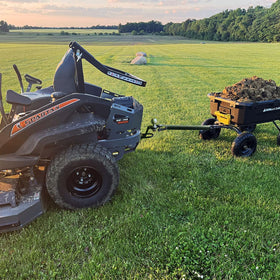 Yantuo attached to ATV towing a trailer and mower demonstrating multi-use capability