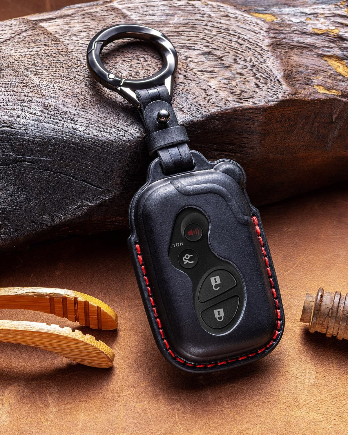 YONUFI leather key fob cover lifestyle shot on nightstand offering stylish protection