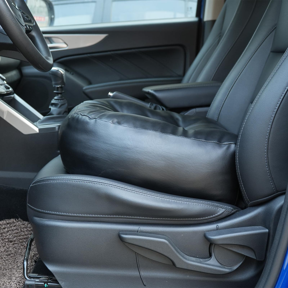YOUFI lifestyle scene of a driver using the cushion for elevated view and comfortable commute