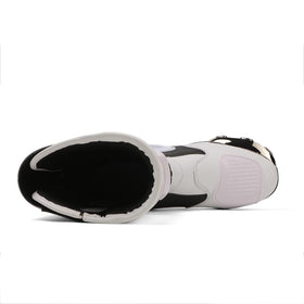 Zeozoom boots on motorcycle footpeg illustrating real-world riding security