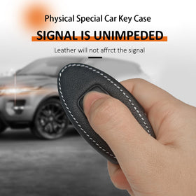 ZERAL key fob in hand showing comfortable grip and scale