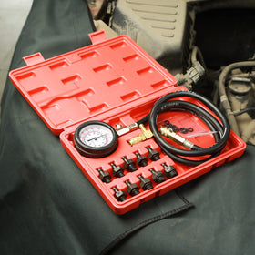 ZJERYL GULL gauge attached to engine port illustrating on-vehicle pressure testing