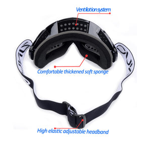 ZJNUO goggles in hand for scale showing compact, portable size