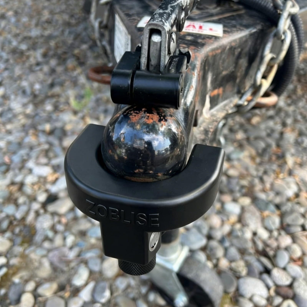 Zoblise lock on a trailer at campsite providing dependable peace of mind