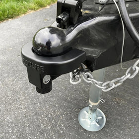 Zoblise lock securing an RV in a driveway providing added travel peace of mind