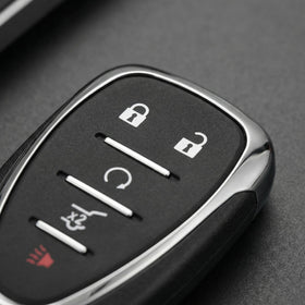 ZODCCHSP fob on driveway near Equinox showing convenient remote access and remote start readiness