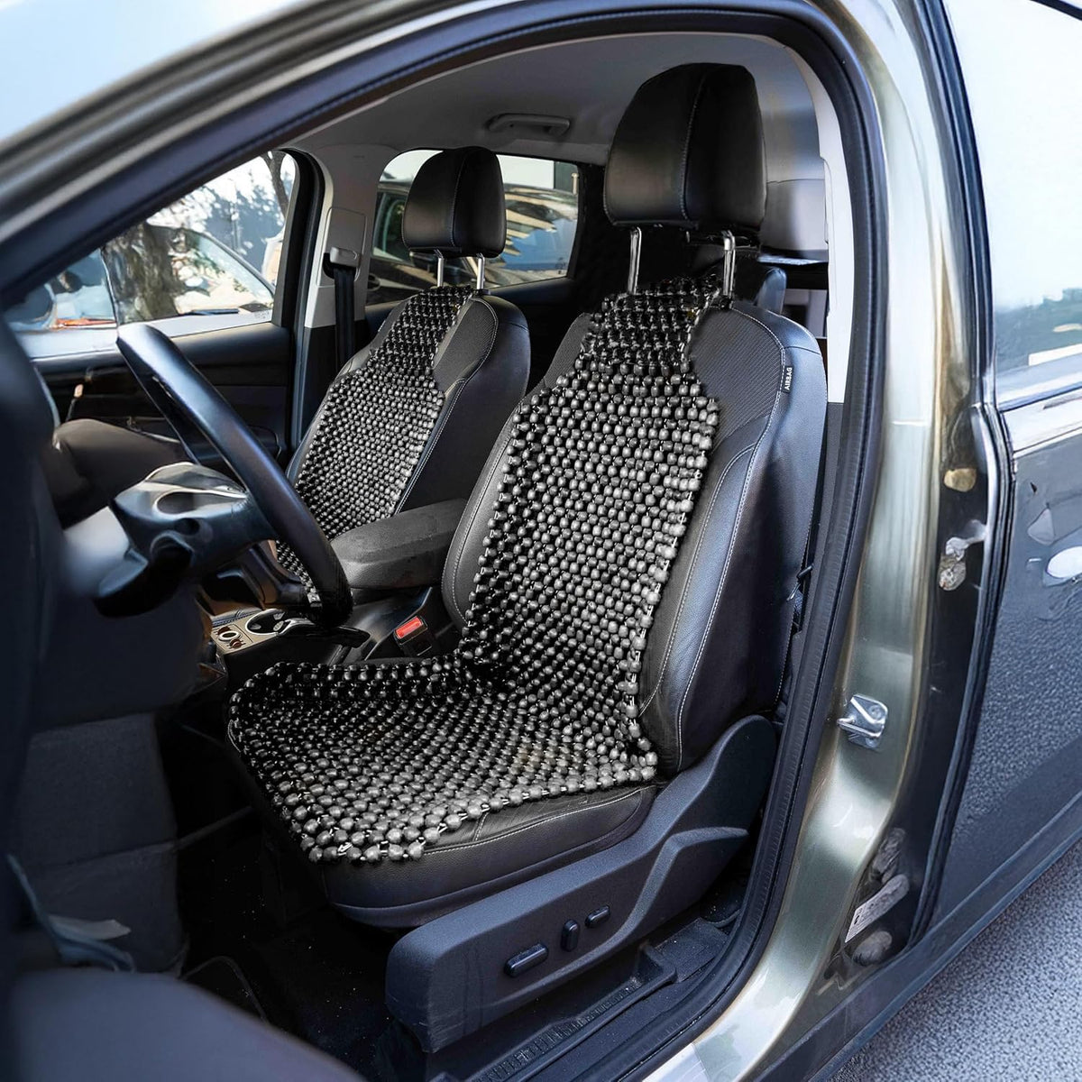 ZONETECH lifestyle image of driver using cushion for all-day comfort