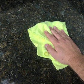 Zwipes towel used for pet grooming absorbing moisture and hair
